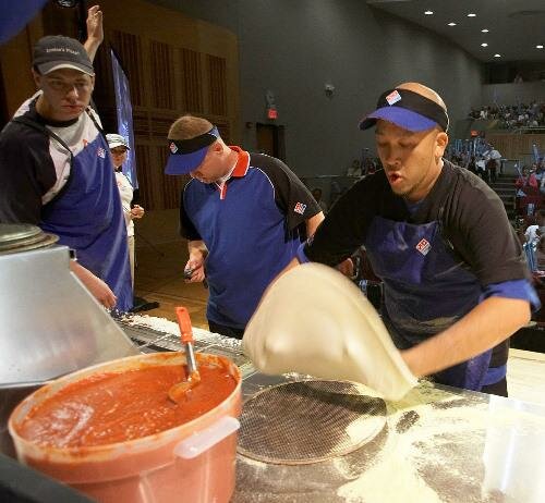 Dennis Tran celebrates victory as World's Fastest Pizza Maker